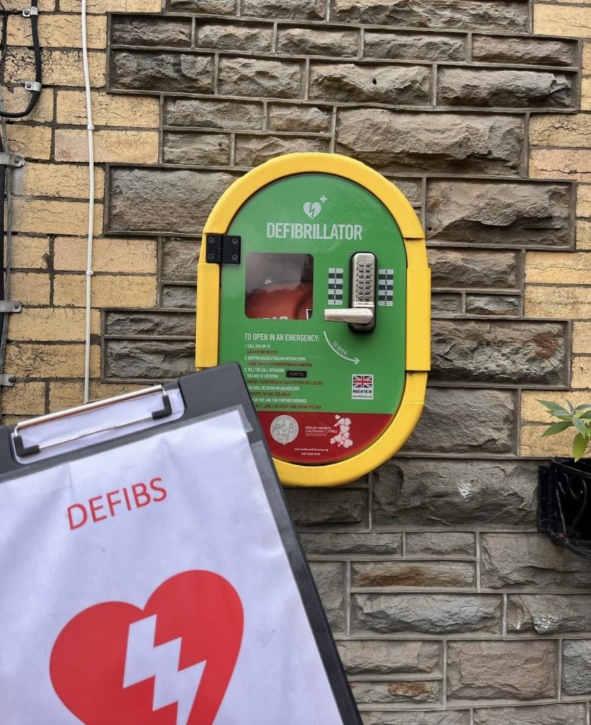 A defibrillator mounted on a wall
